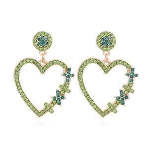 Élégantes boucles d'oreilles cœur dorées avec strass verts et design vintage creux