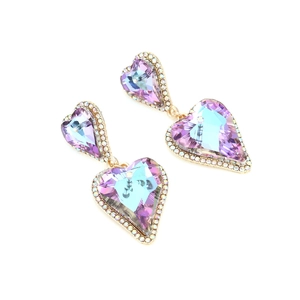 Detailed close-up of purple heart-shaped crystal earrings with sparkling pavé rhinestones
