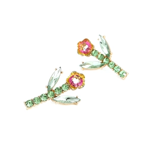 Elegant floral stud earrings with pink petals, green leaves, and colorful crystals