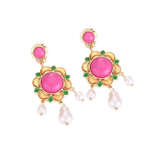 Detail of vintage floral earrings with pink enamel, gold petals and white faux pearls