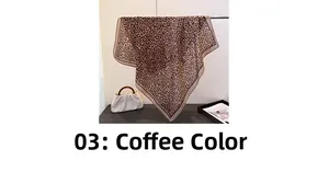 Detailed close-up of brown leopard print square scarf with delicate hemmed edges