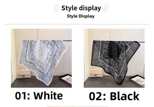 Detail display of paisley pattern square scarves in black and white color options