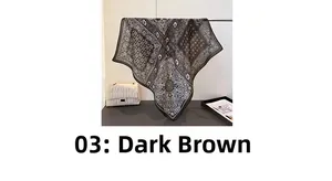 Detailed view of the dark brown paisley print pattern on the soft square silk scarf