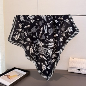 Elegant black and white silk scarf with camellia print and chic fashion elements
