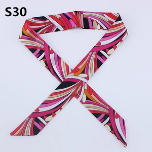 Detailed view of modern geometric patterned twilly scarf with pink and orange abstract lines