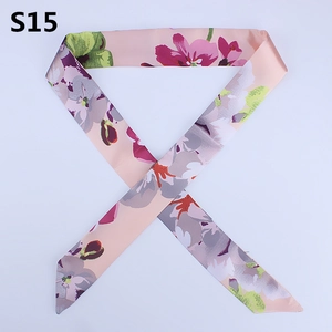 Detailed view of floral pink silk twilly scarf with purple flowers for bag handle wrap