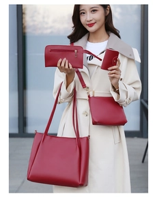 Outdoor lifestyle shot of 4-piece dark red leather handbag set with gold hardware