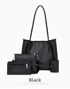 Detailed four-piece black faux leather bag set with gold hardware on white background