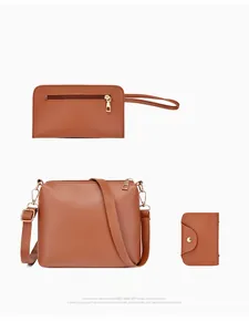 Detailed set of brown leather crossbody bag with matching wallet and card holder accessory