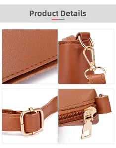 Macro details of brown faux leather texture and light gold metal hardware on bag