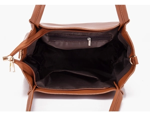 Interior view of brown faux leather handbag showing zippered pockets and lining
