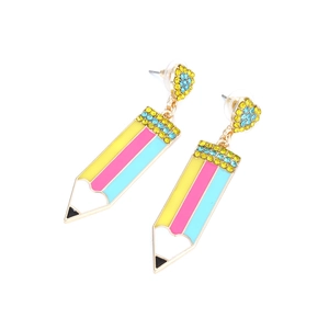 Detailed close-up of striped enamel pencil earrings with heart rhinestones on a white base