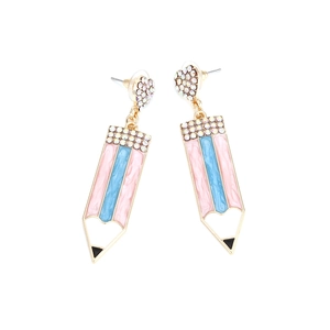 Macro view of pencil-shaped drop earrings with colorful rhinestones and enamel finish
