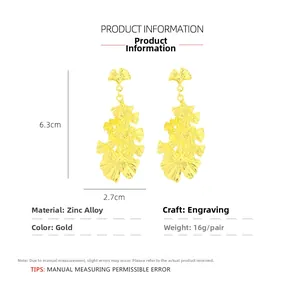 Detailed size chart showing golden ginkgo leaf earrings with 6.3cm height and zinc alloy specs
