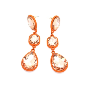 Detailed view of teardrop crystal earrings with orange lacquer frames and layered pendants