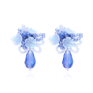 Blue crystal floral earrings with acrylic flower petals and teardrop pendants on white base