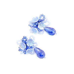 Detailed view of handmade beaded blue flower earrings with transparent water drop pendant