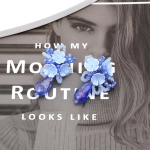 Handmade blue beaded flower drop earrings with acrylic petals and crystal teardrop pendants