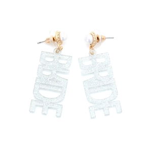 Macro detail of sparkly silver glitter BRIDE letter earrings with white pearl studs
