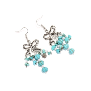 Boucles d'oreilles bohèmes avec nœud, pampilles turquoise et perles en argent vieilli