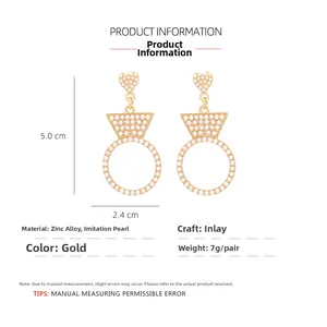 Detail view of heart-shaped pearl earrings with dimension 5.0cm length and 2.4cm width