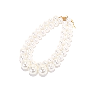 Double-layered baroque faux pearl necklace with gold clasp on white background