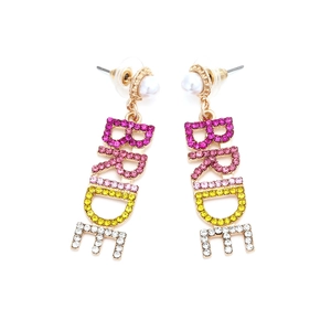 Macro detail of gold BRIDE earrings with colorful rhinestones and white pearls for weddings