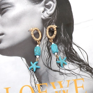 Bohemian vintage starfish drop earrings with turquoise beads and gold textured rings
