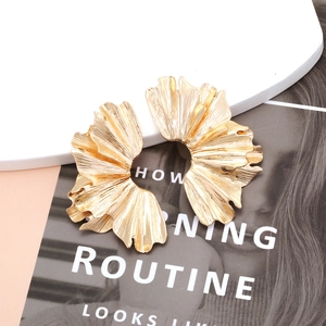Statement oversized gold ginkgo leaf earrings with layered wrinkled texture