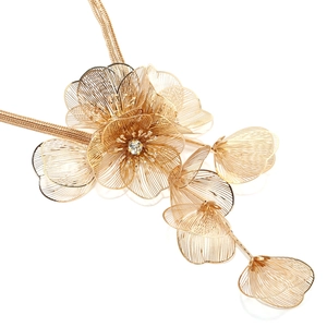 Close-up of golden multi-layer metal flower necklace with sparkling rhinestone and mesh petals