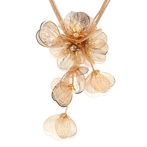 Macro detail of multilayer metal flower necklace with sparkling crystal center