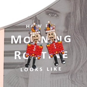Colorful Nutcracker earrings with rhinestones and red beads for a festive fashion look