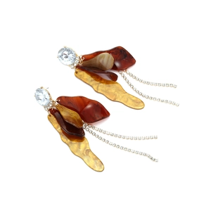 Vintage leaf drop earrings with amber acetate petals and rhinestone tassels on white background