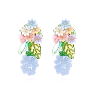 Handmade pastoral style earrings with colorful woven flowers and beaded green leaves