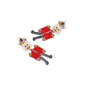 Detail of nutcracker soldier earrings with colorful crystals and enamel finish