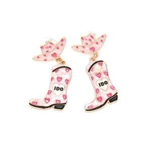 Detailed view of pink cowboy hat and boot earrings with heart patterns and IDO lettering