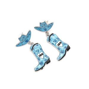 Detail of light blue cowboy hat and boot earrings with IDO text and heart pattern