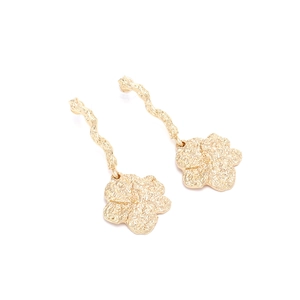 Minimalist gold flower drop earrings with wavy stems and textured metal petals on white background