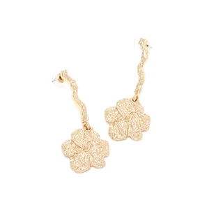 Close-up of golden textured flower drop earrings with elegant branch stems on white background