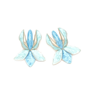 Macro detail of tulip flower earrings with blue-green enamel and gold edges