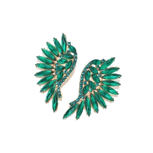 Detailed view of wing earrings with green marquise gems and blue crystal accents
