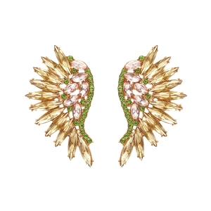 Detailed macro view of colorful crystal wing earrings with gold alloy and champagne stones