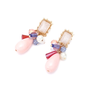 Detail of elegant multilayer handmade beaded earrings with colorful waterdrop charms