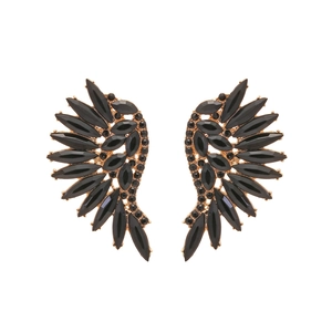 Detailed view of gold-tone angel wing earrings with shimmering black rhinestones