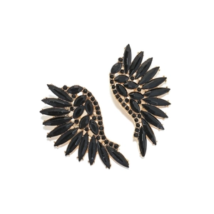 Close-up of black wing earrings with marquise crystals and gold alloy base details