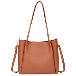 Brown leather tote bag with top handles and adjustable shoulder strap for women