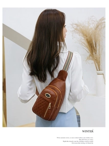 Detailed view of quilted faux leather crossbody chest bag with striped woven strap
