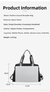 Close-up of a large black nylon tote bag showing spacious interior and size dimensions