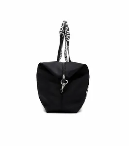 Close-up of waterproof nylon travel bag featuring fashion letter printed shoulder strap