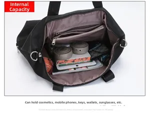 Detailed interior of nylon tote bag showing large capacity compartments and zippered pockets